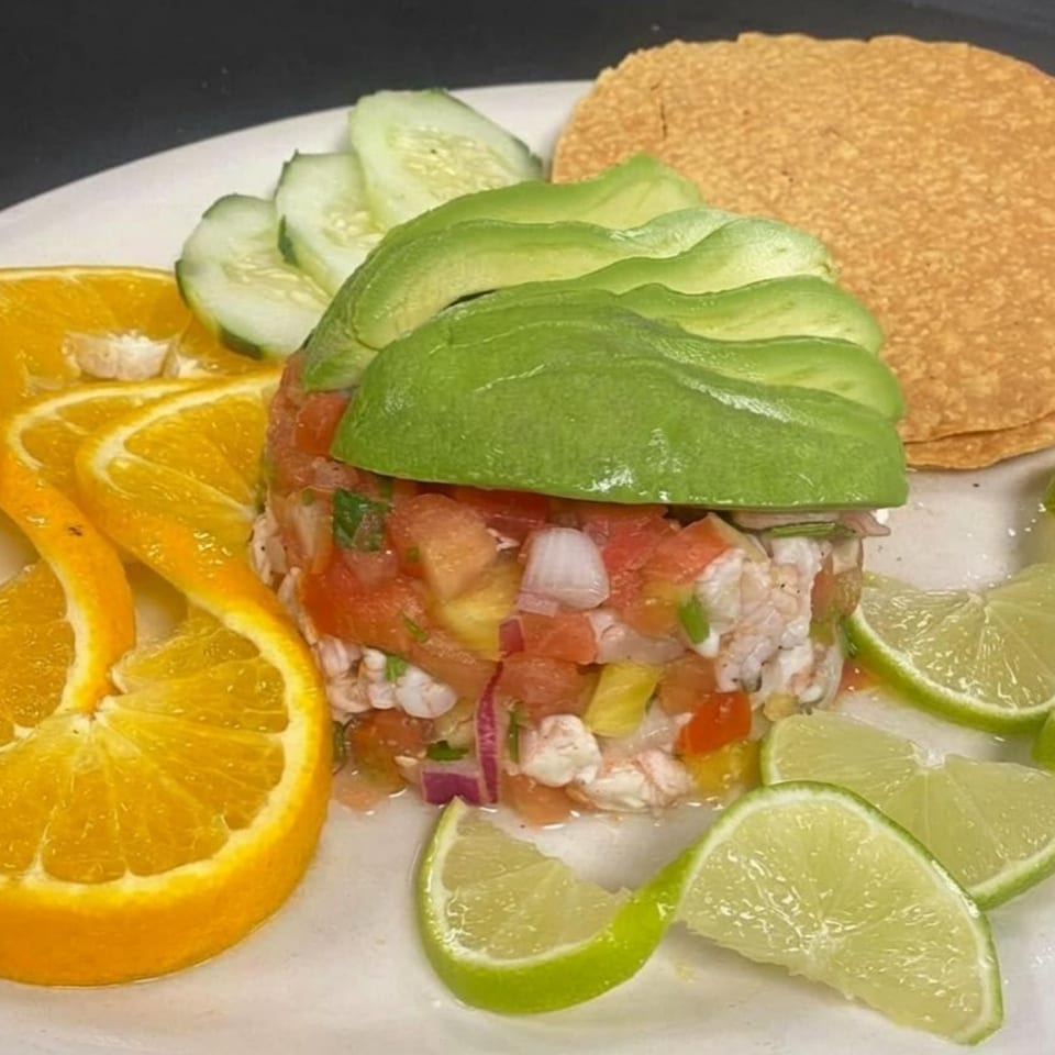 La Barra Del Taco's ceviche with shrimp, avocado, cucumber, orange, lime, and tostadas.